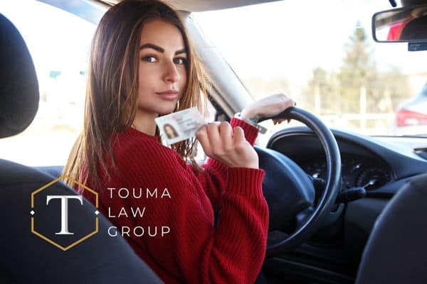 a woman showcasing her temporary license after a DUI
