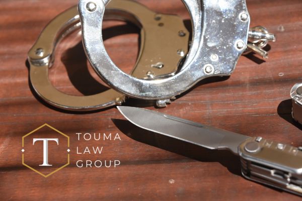 handcuffs next to a knife that was used for a violent crime in South Carolina