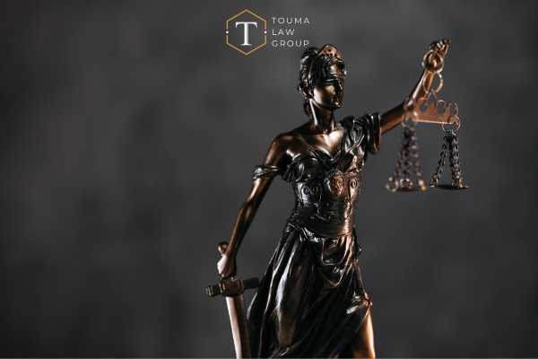 the statue of justice in front of a black background